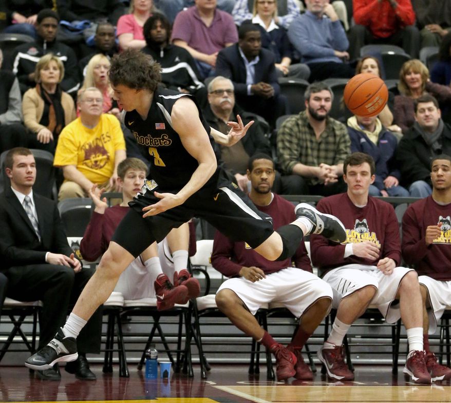 Wichita State guard Evan Wessel (3) save the ball from going out of bounds during the first half of an NCAA college basketball game against Loyola of Chicago Wednesday, Feb. 19, 2014, in Chicago. (AP Photo/Charles Rex Arbogast)