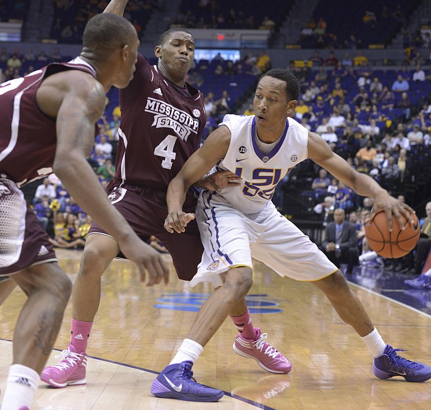Mississippi State's Trivante Bloodman (4) guards LSU's Tim Quarterman during an NCAA college basketball game Wednesday, Feb. 19, 2014, in Baton Rouge, La. (AP Photo/The Baton Rouge Advocate, Heather McClelland)