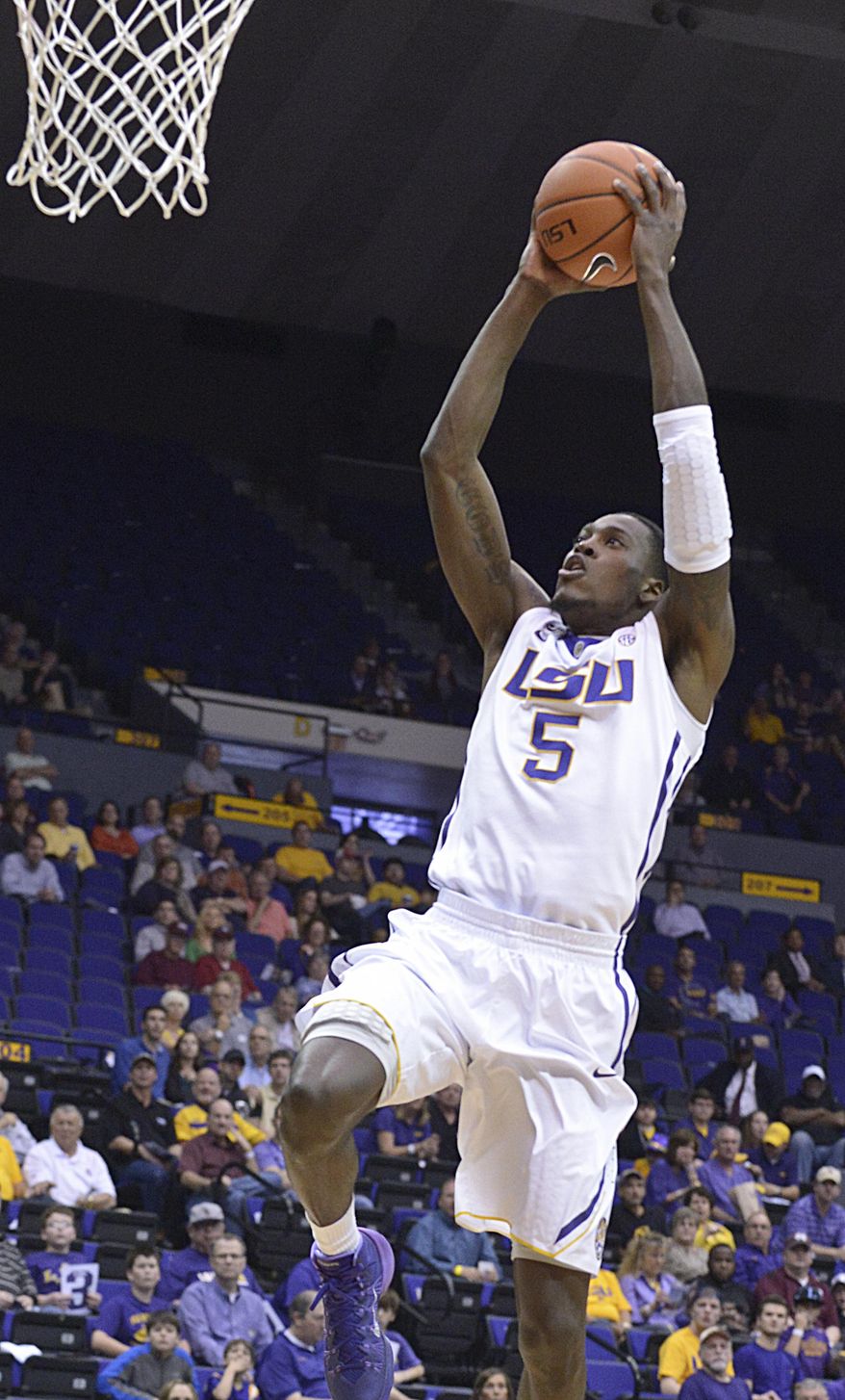 LSU's Shavon Coleman goes in for a dunk against Mississippi State during the first half of an NCAA college basketball game Wednesday, Feb. 19, 2014, in Baton Rouge, La. (AP Photo/The Baton Rouge Advocate, Heather McClelland)