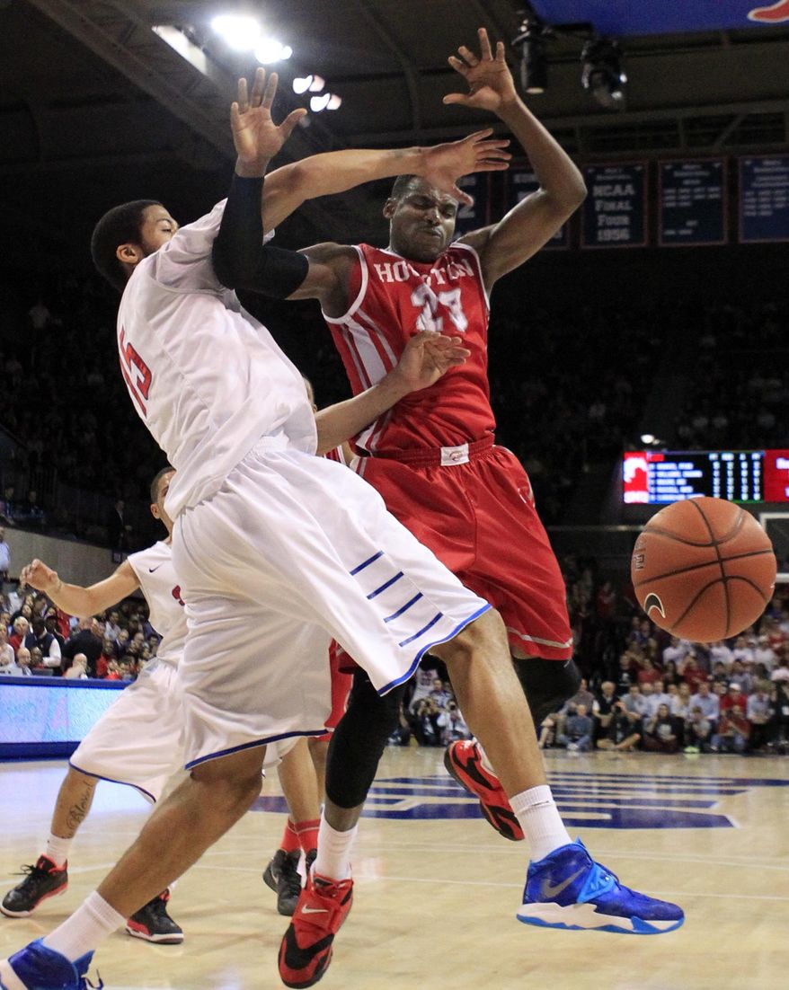 SMU center Cannen Cunningham (15) and Houston forward Danuel House (23) battle under the basket during the first half of an NCAA basketball game on Wednesday, Feb. 19, 2014, in Dallas. (AP Photo/John F. Rhodes)