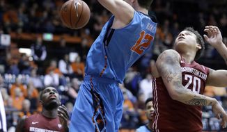 Oregon State center Angus Brandt, from Australia, middle, scores against Washington State&#39;s D.J. Shelton, left, and Jordan Railey during the second half of an NCAA basketball game in Corvallis, Ore., Thursday, Feb. 20, 2014. (AP Photo/Don Ryan)