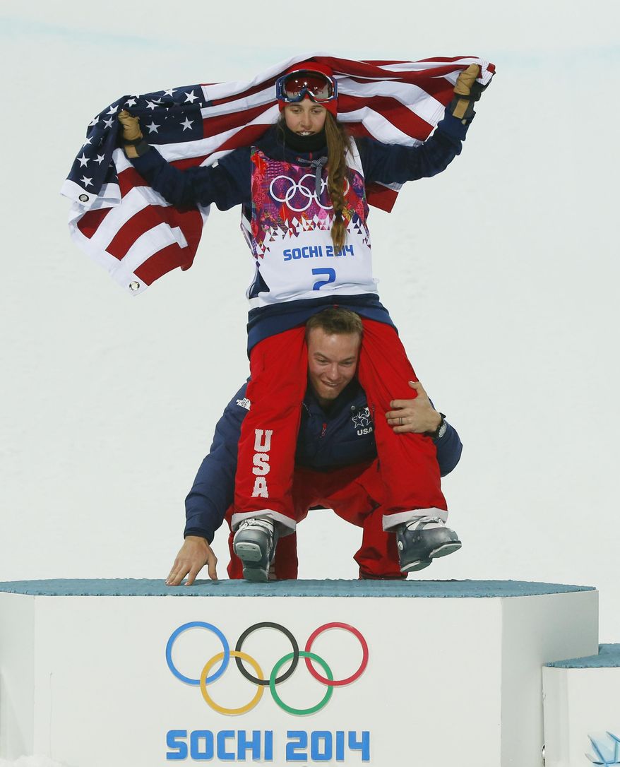 David Wise of the United States, the men&#39;s halfpipe gold medal winner, picks up Maddie Bowman of the United States after she won the gold medal in the women&#39;s ski halfpipe final, at the Rosa Khutor Extreme Park, at the 2014 Winter Olympics, Thursday, Feb. 20, 2014, in Krasnaya Polyana, Russia.(AP Photo/Sergei Grits)