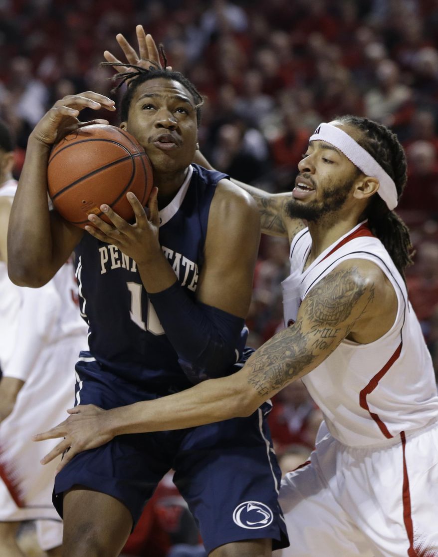 Penn State's Brandon Taylor (10) is defended by Nebraska's Terran Petteway (5) in the first half of an NCAA college basketball game in Lincoln, Neb., Thursday, Feb. 20, 2014. (AP Photo/Nati Harnik)