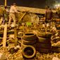 Anti-government protesters reinforce a barricade in central Kiev, late Thursday. Protesters advanced on police lines in the heart of the Ukrainian capital, prompting government snipers to shoot back and kill scores of people. (Associated Press)