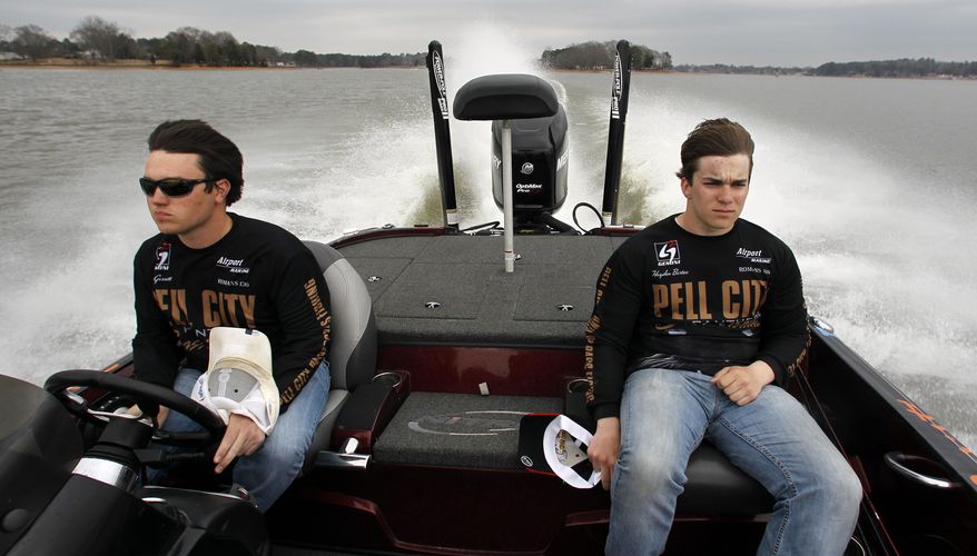 In this Tuesday, Feb. 18, 2014 photo, Pell City Panthers Bass Fishing team members, Zeke Gossett, left, and Hayden Bartee, right, head out to fish on Logan Martin lake in Pell City, Ala. The first B.A.S.S. High School Classic Exhibition Saturday, Feb. 22, 2014 is just the latest example of the rise in opportunities for teens to compete on the lakes. High school anglers from five states will get to weigh in on the same Alabama stage as the pros in this weekend’s Bassmaster Classic. (AP Photo/Butch Dill)