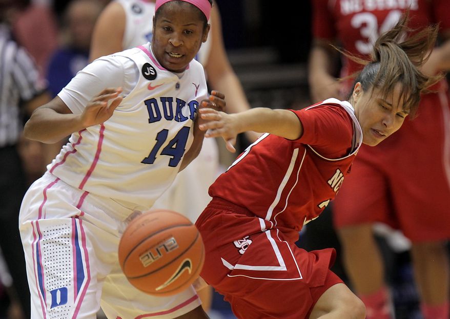 Duke's Ka'lia Johnson (14) battles for a loose ball with NC State's Miah Spencer, right, during the first half of an NCAA college basketball game in Durham, N.C., Thursday, Feb. 20, 2014.  (AP Photo/Ted Richardson)