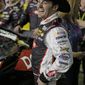 Austin Dillon laughs as he prepares to climb into his car before the first of two NASCAR Sprint Cup series qualifying auto races at Daytona International Speedway in Daytona Beach, Fla., Thursday, Feb. 20, 2014. (AP Photo/John Raoux)