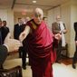 Tibetan spiritual leader the Dalai Lama greets audience members as he arrives to speak at an event entitled: &amp;quot;Happiness, Free Enterprise, and Human Flourishing&amp;quot; Thursday, Feb. 20, 2014, at the American Enterprise Institute in Washington. (AP Photo/Charles Dharapak)