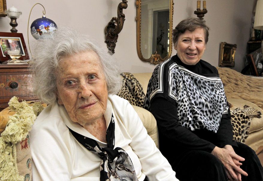 FILE - In this Nov. 8, 2010 file photo, Harriet Butler, now 102, left, and her daughter Marcia Savarese, are photographed at Savarese's home in Vienna, Va. Safety researchers expressed concern a decade ago that traffic accidents would increase as the nation’s aging population swelled the number of older drivers on the road. Now, they say they’ve been proved wrong. Today’s drivers aged 70 and older are less likely to be involved in crashes than previous generations, and less likely to be killed or seriously injured if they do crash, according to a study released Thursday by the Insurance Institute for Highway Safety. That’s because vehicles are getting safer and seniors are generally getting healthier, the institute said. (AP Photo/Alex Brandon, File)