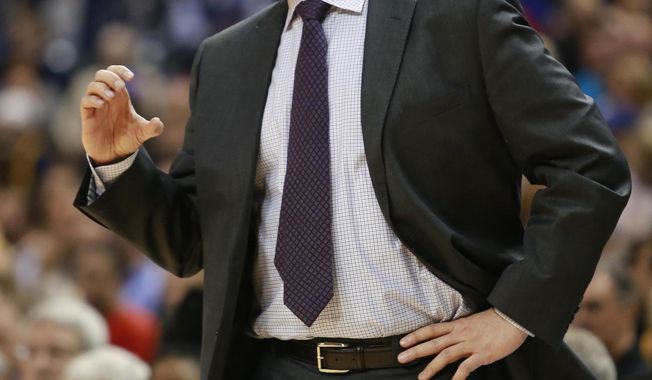 Atlanta Hawks coach Mike Budenholzer gestures to his team during the first half of an NBA basketball game against the Indiana Pacers in Indianapolis, Tuesday, Feb. 18, 2014. The Pacers won 108-98. (AP Photo/R Brent Smith)