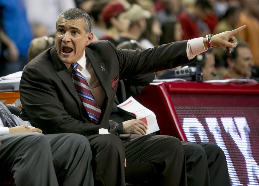 South Carolina head coach Frank Martin yells at his bench during the second half of an NCAA college basketball game against Arkansas, Wednesday, Feb. 19, 2014, in Fayetteville, Ark. (AP Photo/Gareth Patterson)
