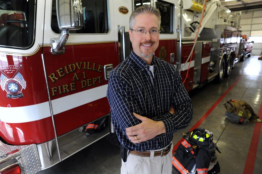 In this photo from Feb. 11, 2014, Chaplin Clint Fleming stands in the Reidville fire station at Reidville, S.C He is launching a ministry called "Responding to the Call" to improve the lives and work ethic of firefighters and other public safety personnel in Spartanburg County. (AP Photo/ Spartanburg Herald-Journal, John Byrum)