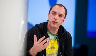 FILE - In this Jan. 20, 2014, file photo, Jan Koum, 38, co- founder of WhatsApp speaks in Munich. On Wednesday, Feb. 20, 2014, photo, Facebook announced it is buying mobile messaging service WhatsApp for up to $19 billion in cash and stock. (AP Photo/dpa, Marc Müller, File)
