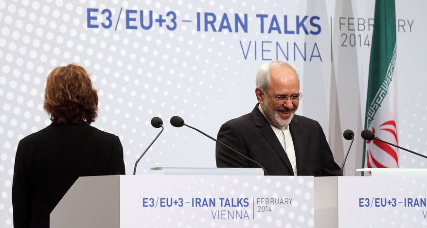 European Union High Representative Catherine Ashton and Iranian Foreign Minister Mohammad Javad Zarif, right, speak to the press after closed-door nuclear talks in Vienna, Austria, Thursday, Feb. 20, 2014. Iran and six world powers are back at the negotiating table eager to come to terms on a comprehensive nuclear deal but deeply divided on what it should look like. The two sides began meeting Tuesday in attempts to build on a first-step accord that temporarily curbs Tehran's nuclear activities in exchange for some sanctions relief. (AP Photo/Ronald Zak)