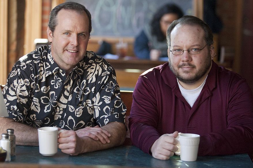 In this Jan. 25, 2014 photo, Monmouth College chemistry professor Brad Sturgeon, left, and student Chris Knutson stop for a cup of coffee at Olivia's Cookie Jar and Kitchen in Monmouth, Ill. Sturgeon is faculty advisor for the Monmouth Coffee Project, which is comprised of students interested in subjects from chemistry to business to design. The project roasts and packages the coffee, where it is available on campus and at Olivia's. (AP Photo/The Register-Mail, Steve Davis)