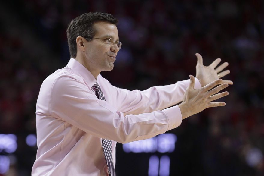 Nebraska coach Tim Miles gestures on the sidelines in the first half of an NCAA college basketball game against Penn State in Lincoln, Neb., Thursday, Feb. 20, 2014. (AP Photo/Nati Harnik)