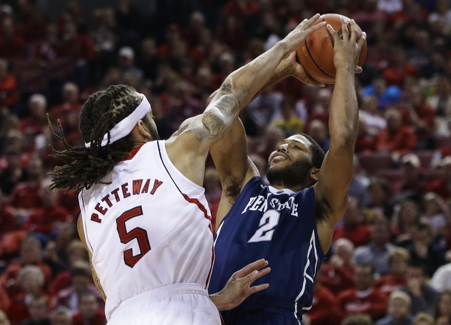 Penn State's D.J. Newbill (2) shoots over Nebraska's Terran Petteway (5) in the first half of an NCAA college basketball game in Lincoln, Neb., Thursday, Feb. 20, 2014. (AP Photo/Nati Harnik)