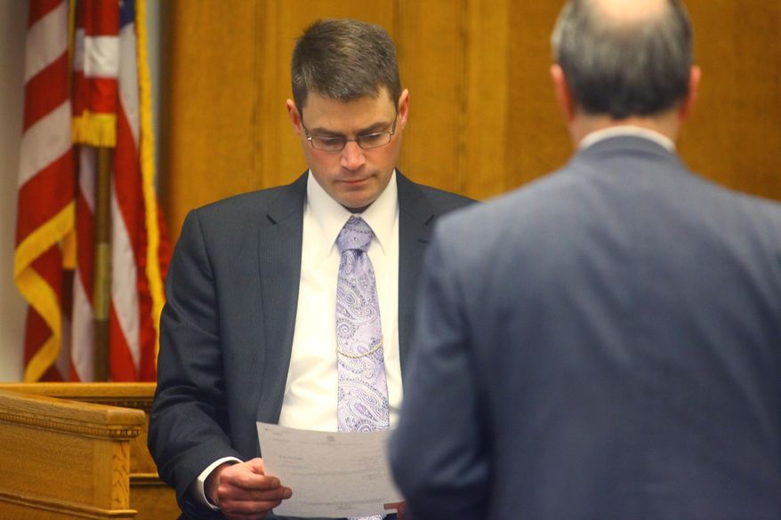 Michigan state police detective David Johnson takes the stand Thursday, Feb. 20, 2014 during the murder trial for Eric John Knysz, 20, in Ludington, Mich. Knysz, 20, is charged with first-degree murder of a peace officer in the killing of Trooper Paul Butterfield II during a traffic stop in September. (AP Photo/Ludington Daily News, Jeff Kiessel) MANDATORY CREDIT