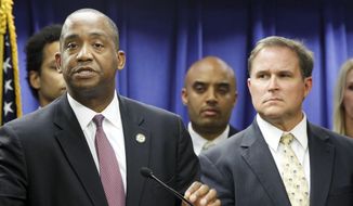 U.S. Attorney Andre Birotte, left, and FBI Assistant Director in Charge Bill Lewis speak at news conference Friday, Feb. 21, 2014, in Los Angeles. Federal law enforcement authorities on Friday announced multiple charges of bribery and cover-ups against state Sen. Ron Calderon, a Democratic state lawmaker and his brother, the result of a long-running corruption investigation that has tarnished the state&#39;s majority party. (AP Photo/ Nick Ut)