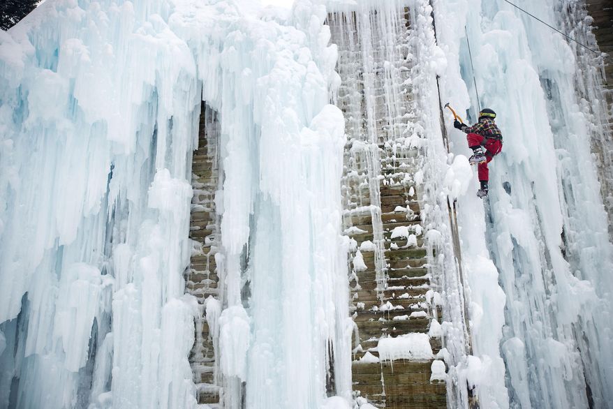 Colter Elementary School fifth grader Briggs Turner scales one of the features at the Teton Ice Park on Wednesday, Feb. 5, 2014 in Jackson, Wyo. Ice climbing is one of several options in the school's Winter Activities program. (AP Photo / Jackson Hole News&Guide, Bradly J. Boner)