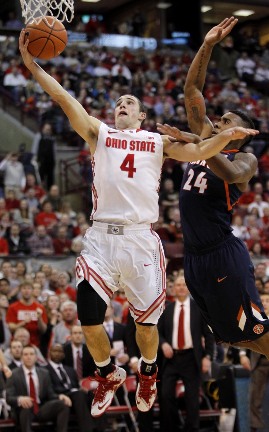 FILE - In this Jan. 23, 2014 file photo, Ohio State's Aaron Craft, left, goes up for a shot against Illinois' Rayvonte Rice during the second half of an NCAA college basketball game in Columbus, Ohio.  No. 24 Ohio State, still dogged by a bad spell in January, tries to stack together some solid wins as it heads into the Big Ten and NCAA tournaments. The next test comes Saturday against Minnesota, which beat the Buckeyes 63-53 when they went through that 1-5 downward spiral. ( AP Photo/Paul Vernon, File)