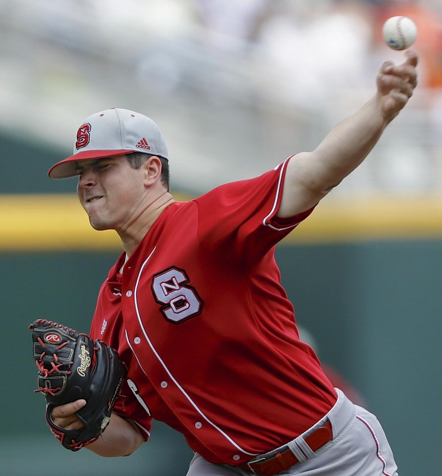 FILE - In this June 16, 2013, file photo, North Carolina State starting pitcher Carlos Rodon throws against North Carolina during an NCAA College World Series baseball game in Omaha, Neb. N.C. State was ranked No. 5 in the preseason by Baseball America and boasts the publication's choice for the nation's top pitcher in Rodon and the top position player in Trea Turner. (AP Photo/Nati Harnik, File)