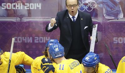 Sweden head coach Par Marts talks to the team during a break in the action against Finland during the second period of the men&#x27;s semifinal ice hockey game at the 2014 Winter Olympics, Friday, Feb. 21, 2014, in Sochi, Russia. (AP Photo/Matt Slocum)