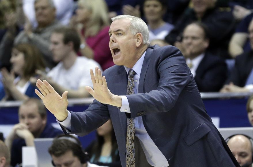 Brigham Young head coach Dave Rose shouts to his team in the first half of an NCAA college basketball game against Gonzaga Thursday, Feb. 20, 2014, in Provo, Utah. (AP Photo/Rick Bowmer)