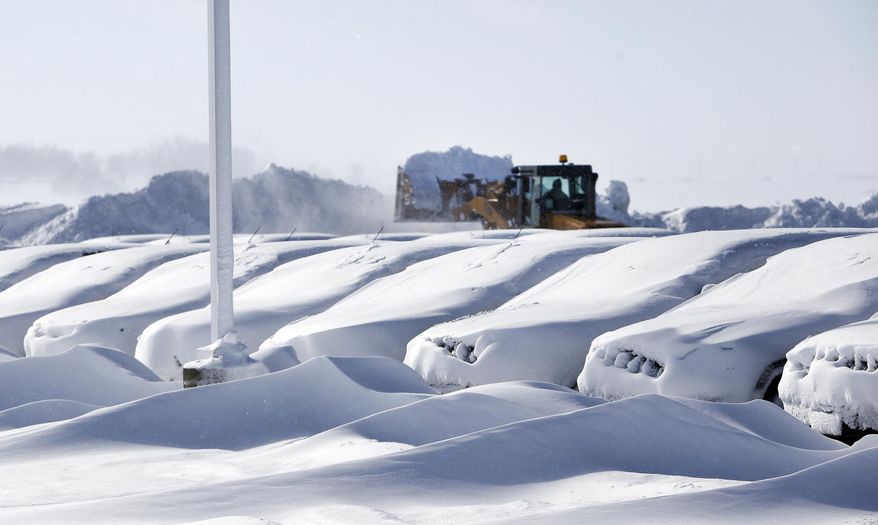 Blizzard-like conditions cover cars at Walser Chevrolet near along I-35 Friday, Feb. 21, 2014 near Owatonna, Minn. Friday's daytime low dropped to 7 degrees, making this winter the 11th coldest winter on record, National Weather Service chief meteorologist Dan Luna in Chanhassen said. The average temperature has been 10.3 degrees. (AP Photo/The Star Tribune, Elizabeth Flores) MANDATORY CREDIT; ST. PAUL PIONEER PRESS OUT; MAGS OUT; TWIN CITIES TV OUT