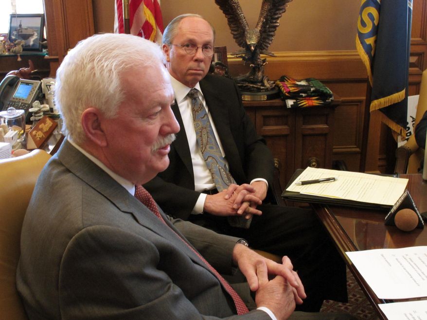 Kansas House Speaker Ray Merrick, left, a Stilwell Republican, talks to reporters, along with commerce committee Chairman Marvin Kleeb, right, an Overland Park Republican, Friday, Feb. 21, 2014, at the Statehouse in Topeka, Kan. They say GOP lawmakers are working on plenty of low-profile but important pro-business bills. (AP Photo/John Hanna)