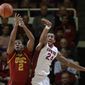 Southern California forward Roschon Prince (2) battles for a rebound against Stanford forward Josh Huestis (24) during the first half of an NCAA college basketball game on Thursday, Feb. 20, 2014, in Stanford, Calif. (AP Photo/Marcio Jose Sanchez)