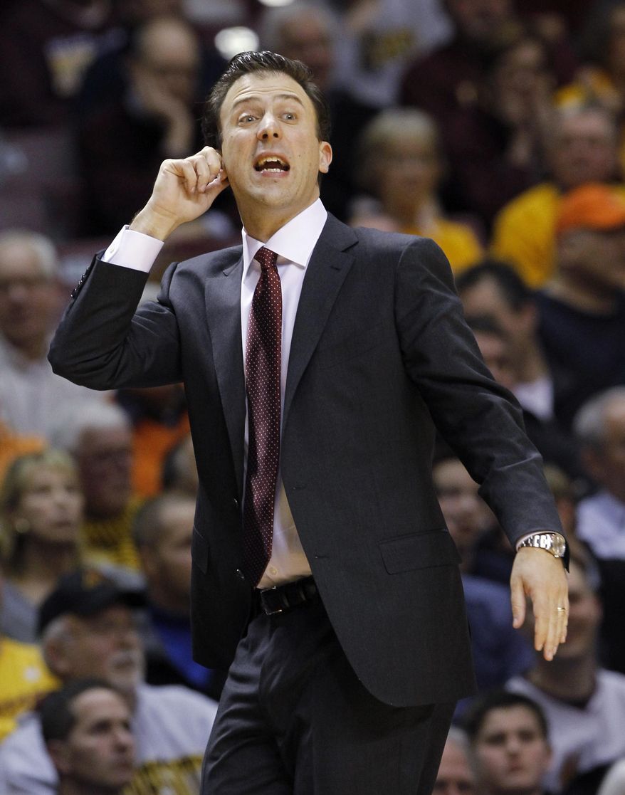 FILE - In this Feb. 19, 2014, file photo, Minnesota head coach Richard Pitino tugs on his ear as he calls out to his players during the second half of an NCAA college basketball game against Illinois in Minneapolis.  No. 24 Ohio State, still dogged by a bad spell in January, tries to stack together some solid wins as it heads into the Big Ten and NCAA tournaments. The next test comes Saturday against Minnesota, which beat the Buckeyes 63-53 when they went through that 1-5 downward spiral. (AP Photo/Ann Heisenfelt, File)