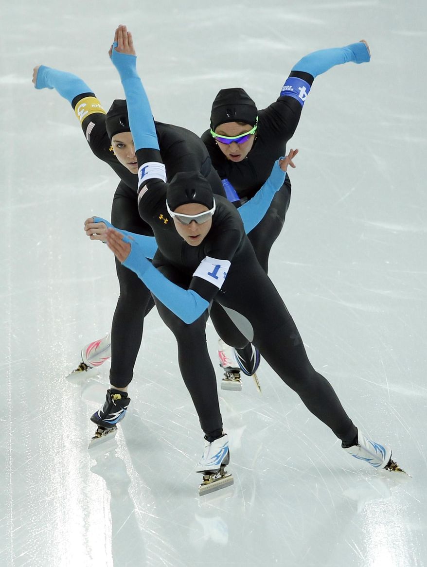 Speedskaters from the U.S. Brittany Bowe, Heather Richardson, and Jilleanne Rookard, front to rear, compete in the women's speedskating team pursuit quarterfinals at the Adler Arena Skating Center during the 2014 Winter Olympics in Sochi, Russia, Friday, Feb. 21, 2014. (AP Photo/Patrick Semansky)