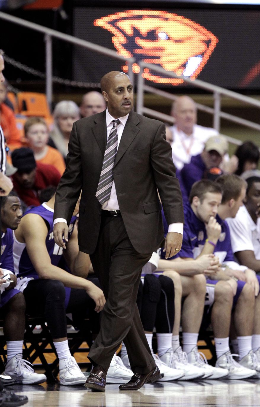 Washington coach Lorenzo Romar paces in front of the bench during the first half of an NCAA basketball game against Oregon State in Corvallis, Ore., Saturday, Feb. 22, 2014.(AP Photo/Don Ryan)