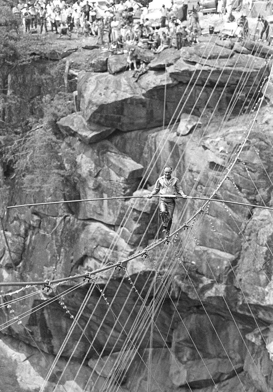 FILE - In this July 18, 1970 file photo, Karl Wallenda walks across the cable above the nearly 1,000-foot deep Tallulah Gorge in Tallulah Falls, Ga. In a Feb. 8, 2014 interview, his great-grandson, Nik Wallenda, said hopes to accomplish the same feat in the near future. (AP Photo/Bob Schutz)