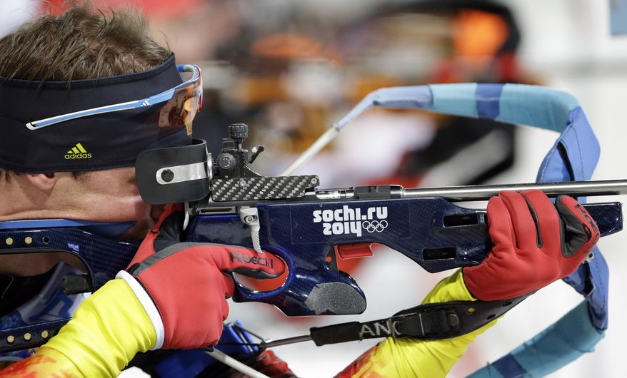 Germany's Simon Schempp shoots during the men's biathlon 4x7.5K relay at the 2014 Winter Olympics, Saturday, Feb. 22, 2014, in Krasnaya Polyana, Russia. (AP Photo/Lee Jin-man)