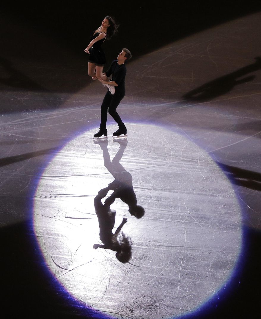 Elena Ilinykh and Nikita Katsalapov of Russia perform during the figure skating exhibition gala at the Iceberg Skating Palace during the 2014 Winter Olympics, Saturday, Feb. 22, 2014, in Sochi, Russia. (AP Photo/Vadim Ghirda)