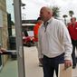 Atlanta Braves manager Fredi Gonzalez and others, arrive for a meeting about baseballs new instant replay rules at the spring training facility for the Houston Astros, Friday, Feb. 21, 2014, in Kissimmee, Fla. (AP Photo/Alex Brandon)