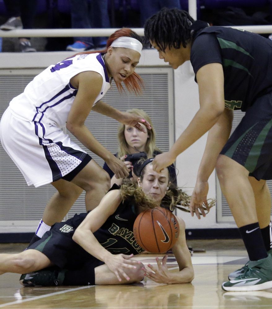 Baylor center Mariah Chandler (11)  grabs the loose ball against TCU guard Natalie Ventress (24) during the first half of an NCAA college basketball game Saturday, Feb. 22, 2014, in Fort Worth, Texas.  Looking on is Baylor center Kristina Higgins (44), (AP Photo/LM Otero)