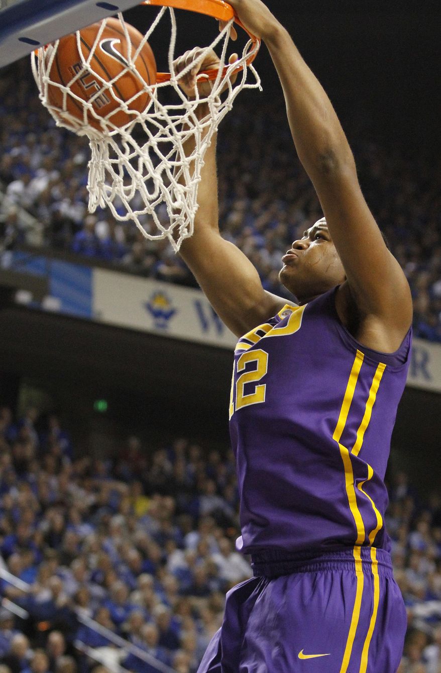 LSU's Jarell Martin dunks during the first half of an NCAA college basketball game against Kentucky, Saturday, Feb. 22, 2014, in Lexington, Ky. (AP Photo/James Crisp)