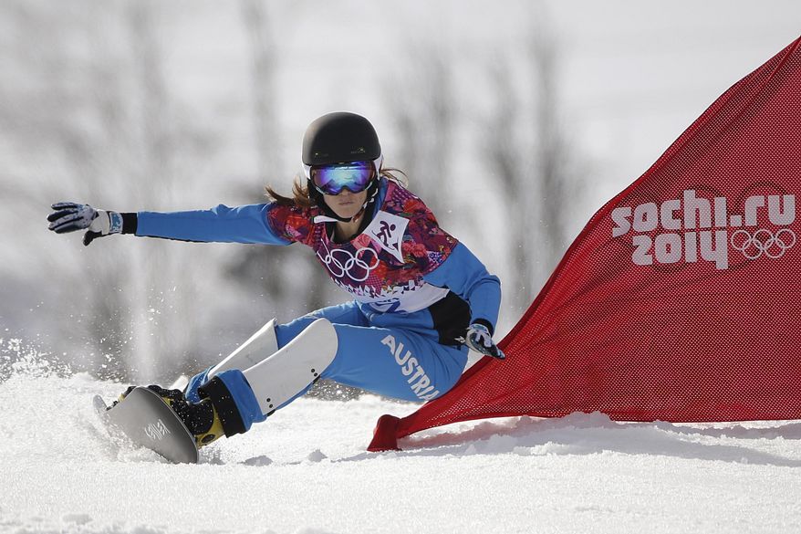 Austria's Julia Dujmovits competes during the women's snowboard parallel slalom final at the Rosa Khutor Extreme Park, at the 2014 Winter Olympics, Saturday, Feb. 22, 2014, in Krasnaya Polyana, Russia. Dujmovits won the gold medal. (AP Photo/Jae C. Hong)