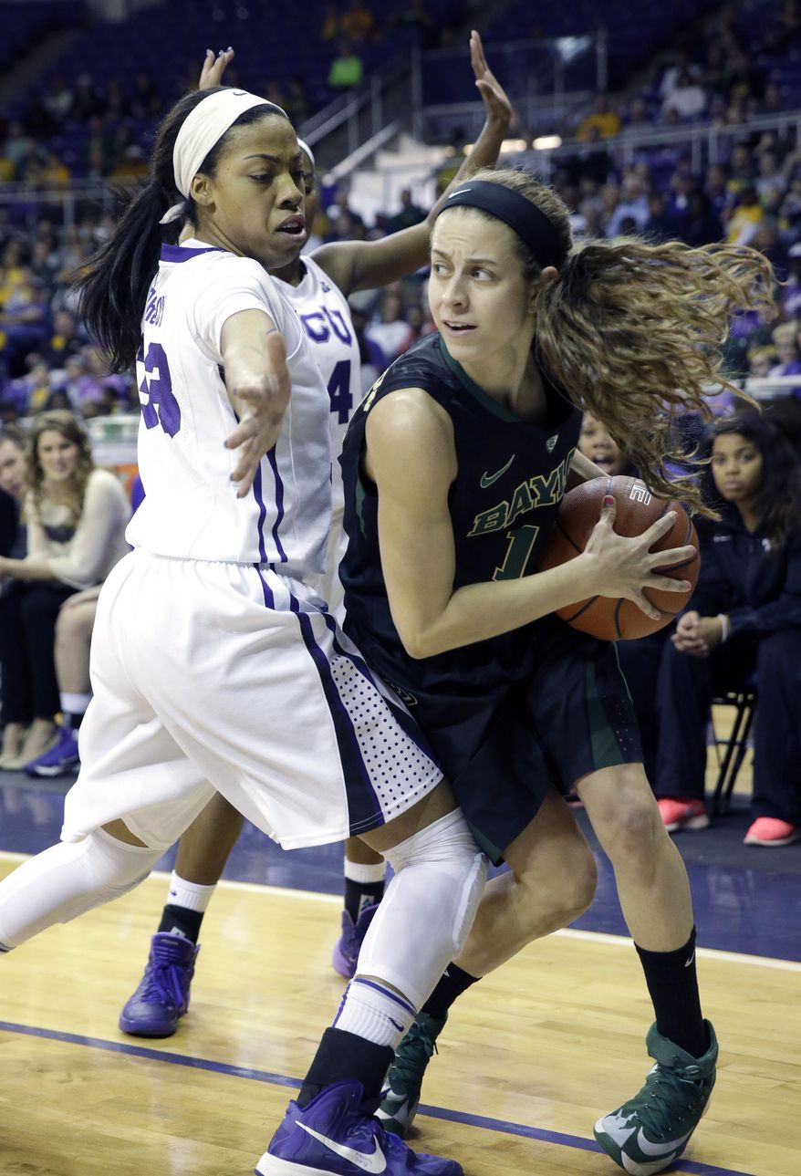 Baylor Mariah Chandler (11) looks to pass against TCU guard Donielle Breaux (33)  during the first half of an NCAA college basketball game Saturday, Feb. 22, 2014, in Fort Worth, Texas. (AP Photo/LM Otero)