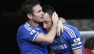 Chelsea&#x27;s Frank Lampard, left, embraces his captain John Terry, after scoring against Everton during an English Premier League soccer match at the Stamford Bridge ground in London, Saturday, Feb. 22, 2014. Chelsea won the match 1-0. (AP Photo/Lefteris Pitarakis)