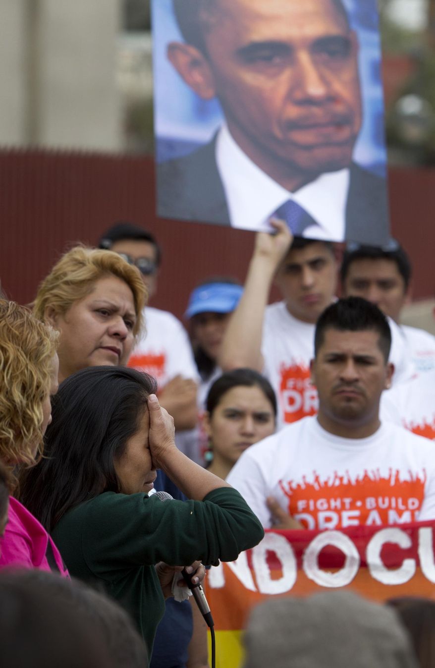 Herminia Gallego, of Mesa, Ariz., shares her story about how her sister-in-law, daughter, and husband are all currently in detention during a protest march Saturday, Feb. 22, 2014, to Phoenix Detention Center (ICE Downtown Detention Center) demanding President Obama stop deportations now. (AP Photo/ The Arizona Republic, Cheryl Evans)