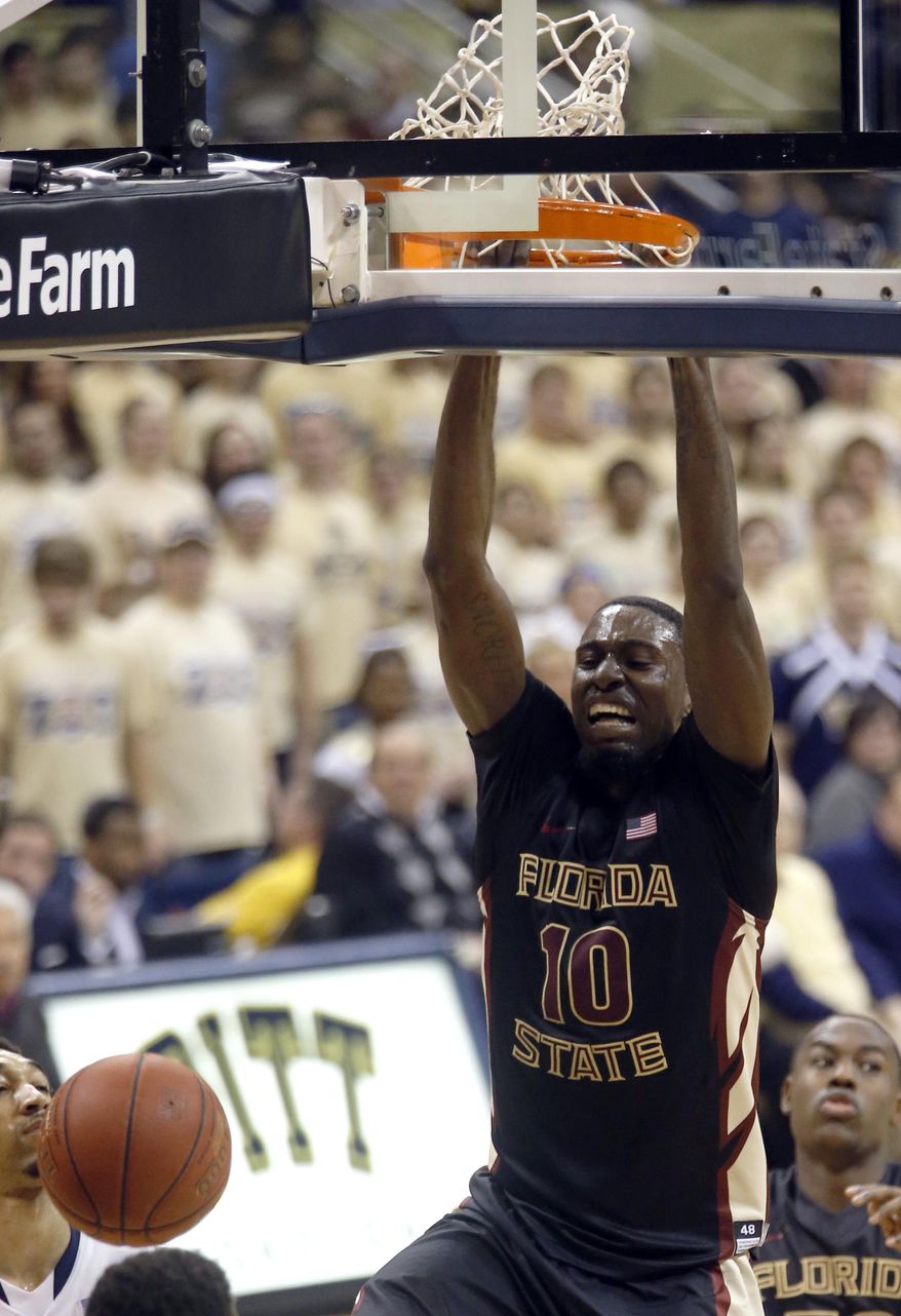 Florida State's Okaro White (10) dunks during the second half of an NCAA college basketball game against Pittsburgh, Sunday, Feb. 23, 2014, in Pittsburgh. (AP Photo/Keith Srakocic)