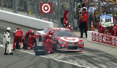 Crew members work to repair Kyle Larson's car during the NASCAR Daytona 500 Sprint Cup series auto race at Daytona International Speedway, Sunday, Feb. 23, 2014, in Daytona Beach, Fla.. (AP Photo/David Graham)