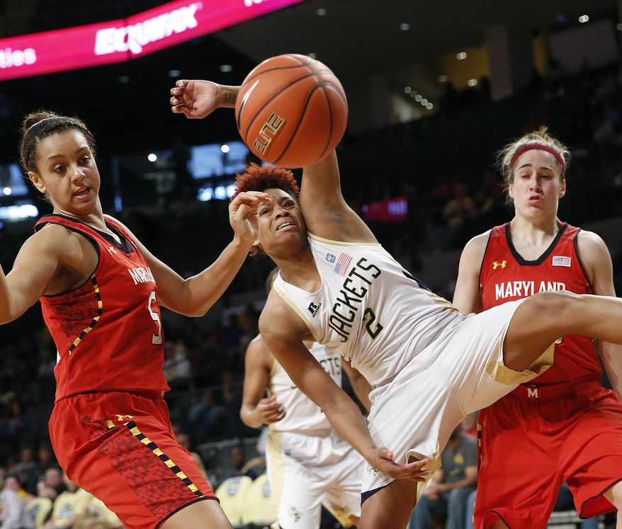 Georgia Tech's Aaliyah Whiteside (2) and Maryland center Malina Howard (5) battle for a rebound as Maryland guard Katie Rutan, looks on at right, in the second half of an NCAA women's college basketball game, Sunday, Feb. 23, 2014, in Atlanta. (AP Photo/John Bazemore)