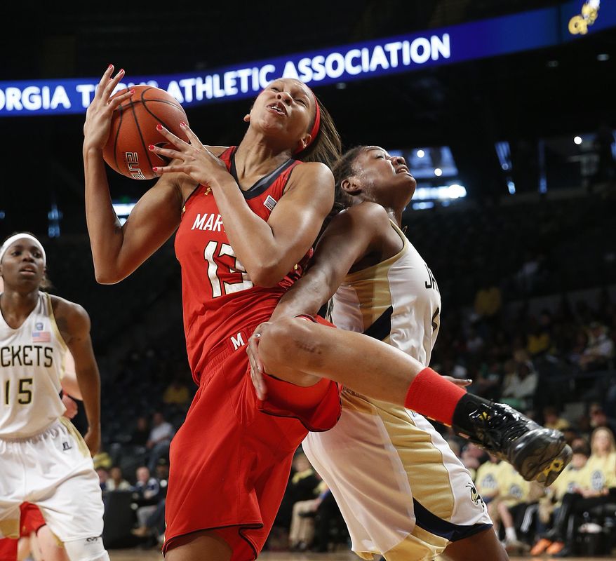 Maryland center Alicia DeVaughn (13) comes down with a rebound against Georgia Tech forward Roddreka Rogers (54) in the second half of an NCAA women's college basketball game, Sunday, Feb. 23, 2014, in Atlanta. (AP Photo/John Bazemore)