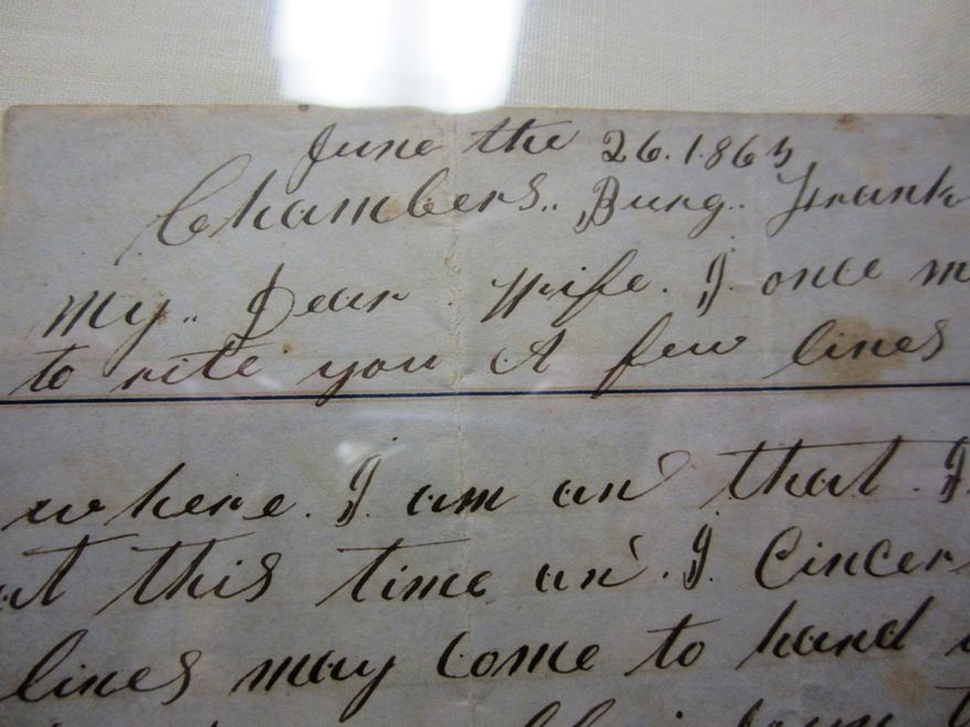ADVANCE FOR MONDAY FEB. 24 AND THEREAFTER - This Sunday Feb. 16, 2014 photo shows a recently-donated collection of letters written by a Civil War soldier from Pittsylvania County to his wife, at the museum in Danville, Va. The elaborate script and often-misspelled words of Pvt. Joseph Payne’s letters home to his wife have made transcribing them a challenge. (AP Photo/The Register & Bee, Denice Thibodeau)