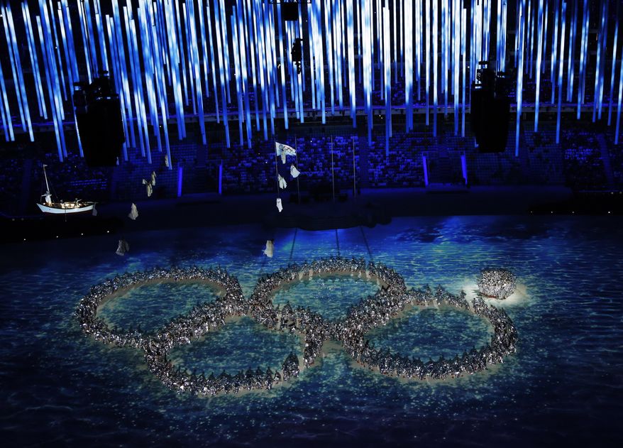 Performers recreate the fifth Olympic ring that didn't open in the opening ceremony during the closing ceremony of the 2014 Winter Olympics, Sunday, Feb. 23, 2014, in Sochi, Russia. (AP Photo/David J. Phillip )